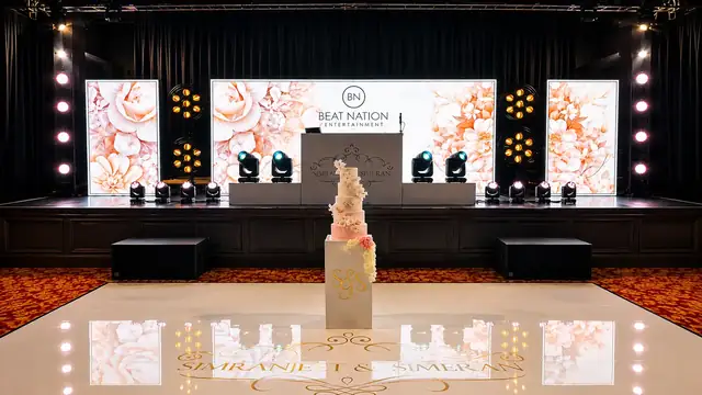 A wedding stage set with LED panels and a starlit floor